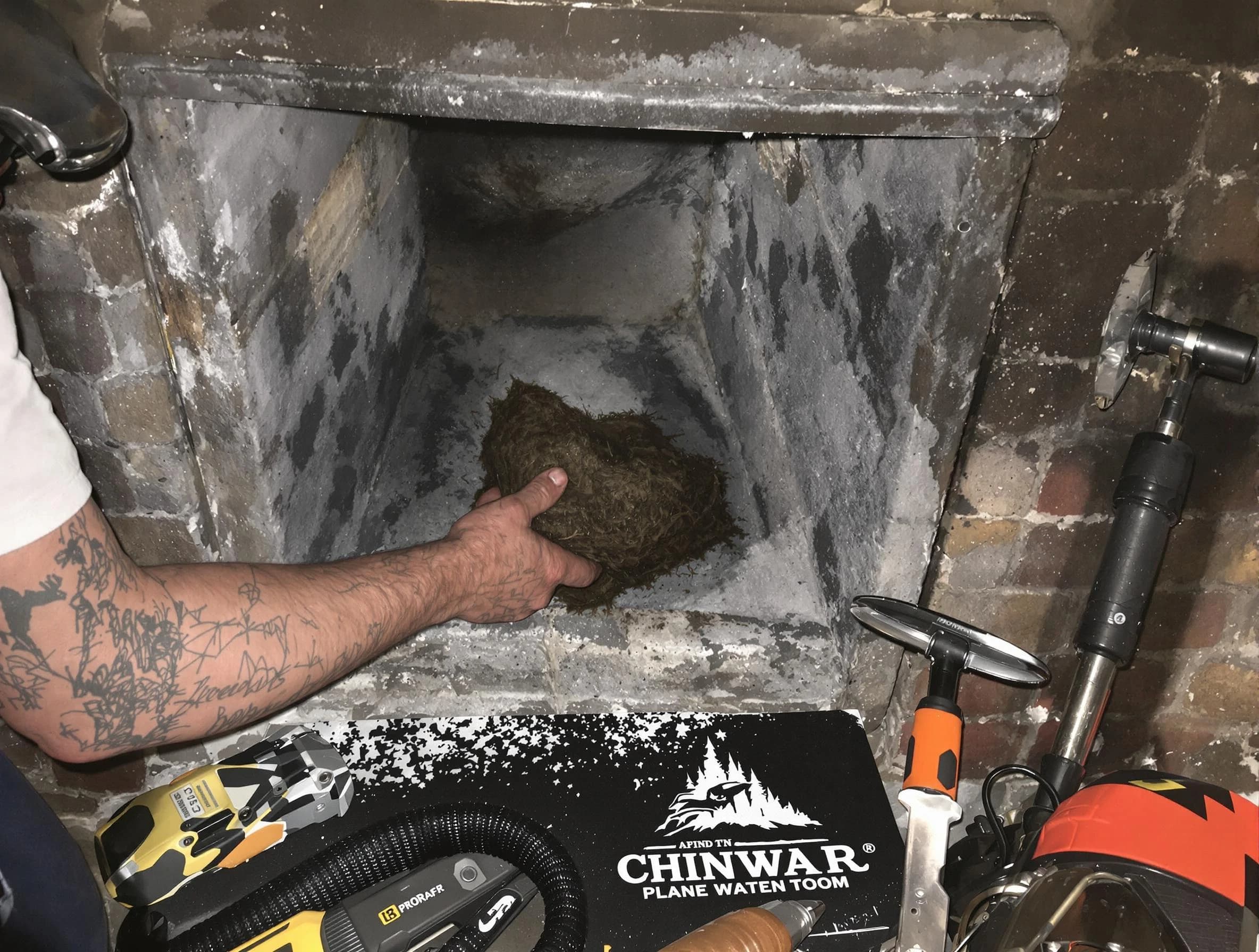 Passaic Chimney Sweep safely removing debris and screening chimney in Passaic, NJ